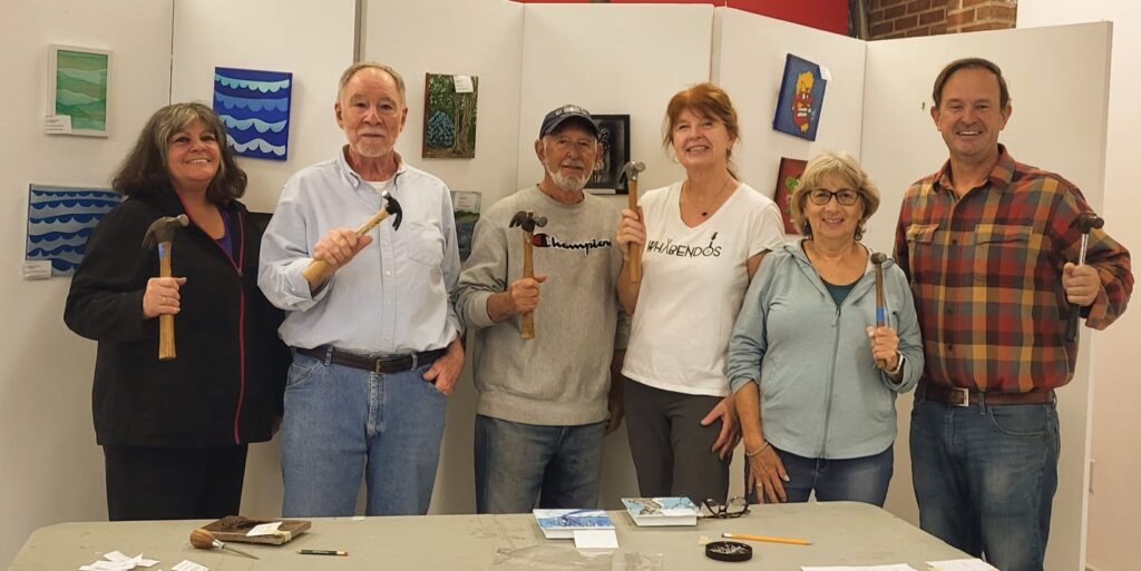 Curator with Hanging Crew Volunteers